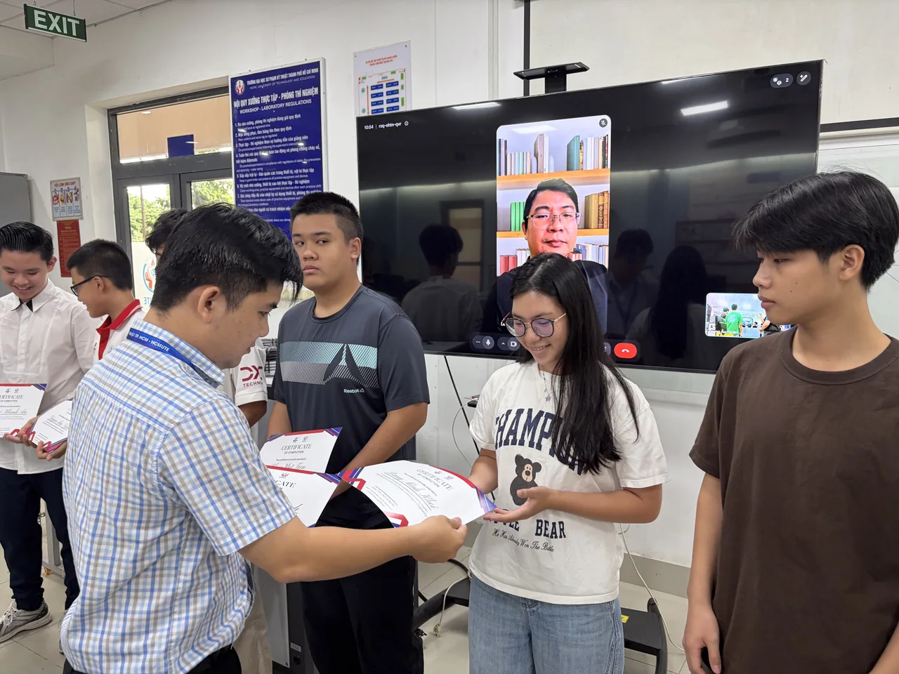 Students exploring technology at an exhibition