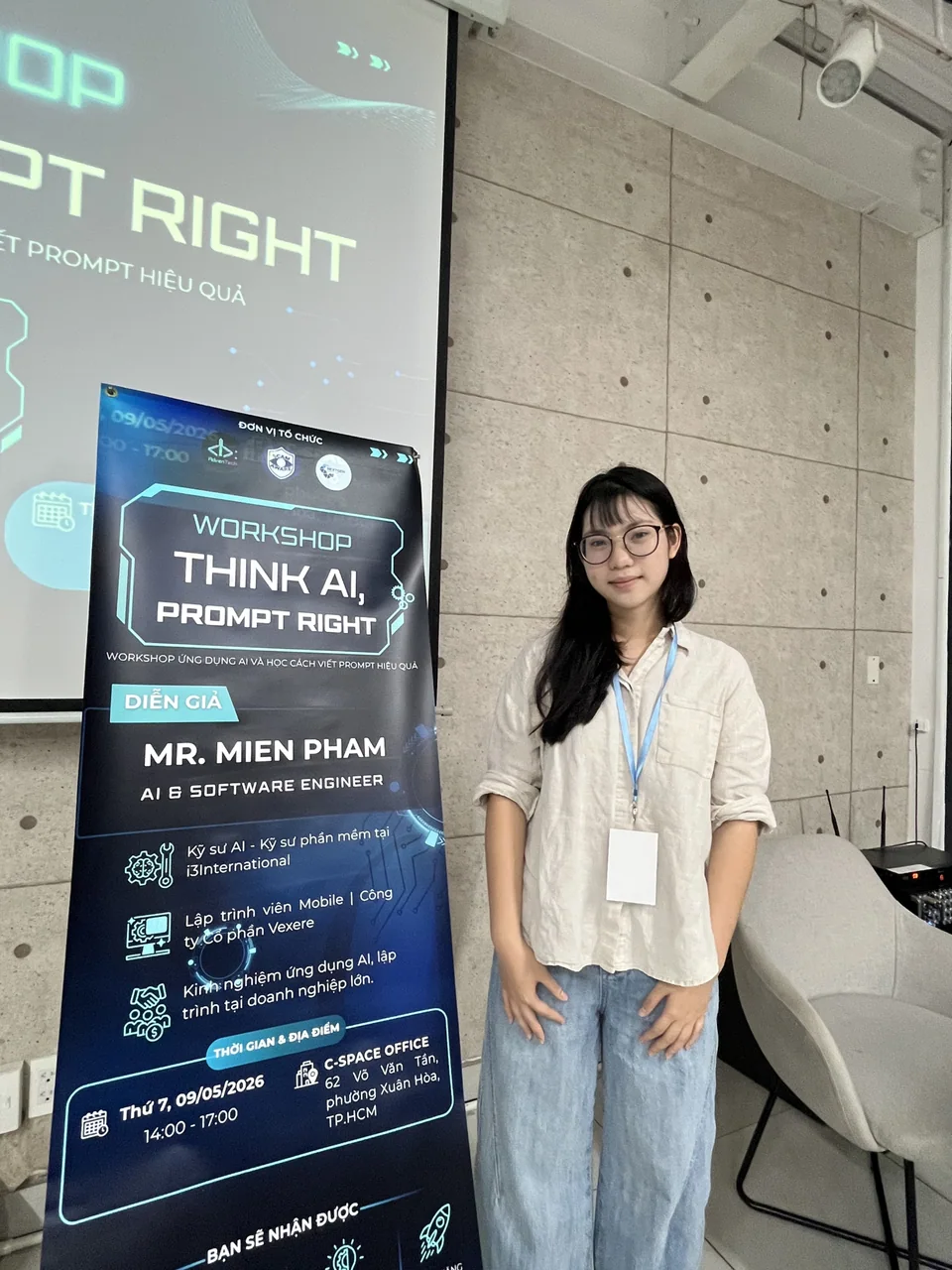 Châu Thảo beside the architectural AI research poster