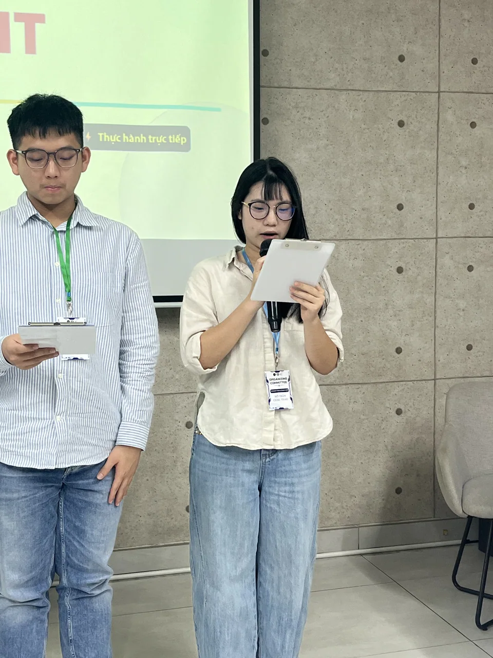 Châu Thảo and a teammate holding their project awards